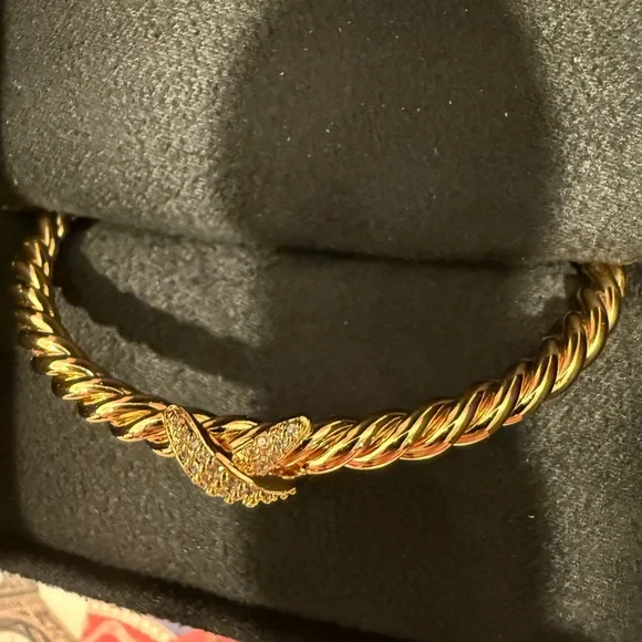 18m Gold Plated Twisted Bracelet with Simulated Diamond X Accents .
